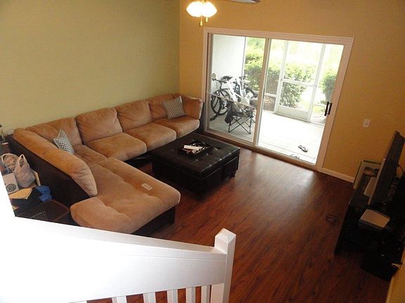 Living room and screened in porch overlooking pond