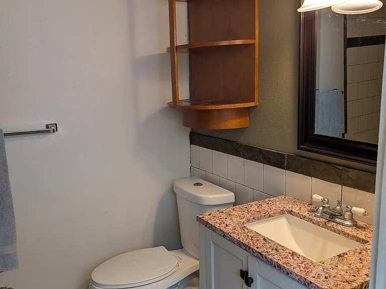 Back bathroom has a stall-style shower to make room for the stackable washer/dryer.