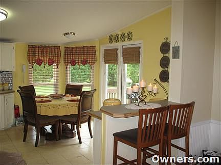 Breakfast nook with patio doors to side deck.