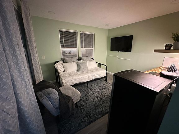 Living, bedroom, and kitchen area