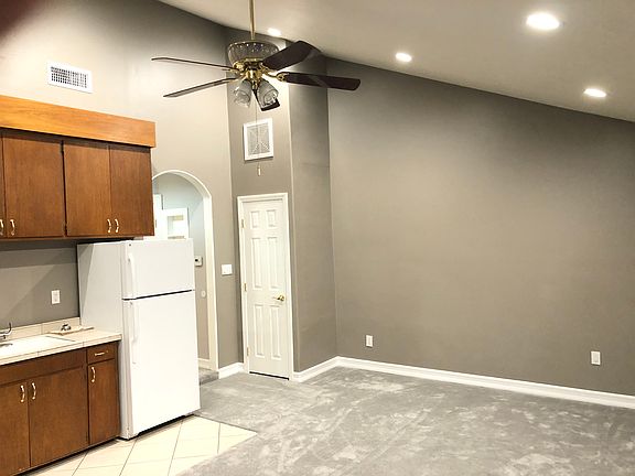 Living room facing kitchen.