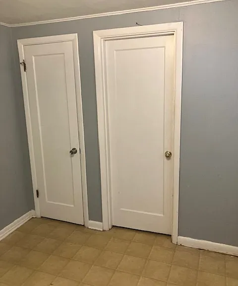 Bedroom 2, one door is to walk-in closet, other door is to bathroom