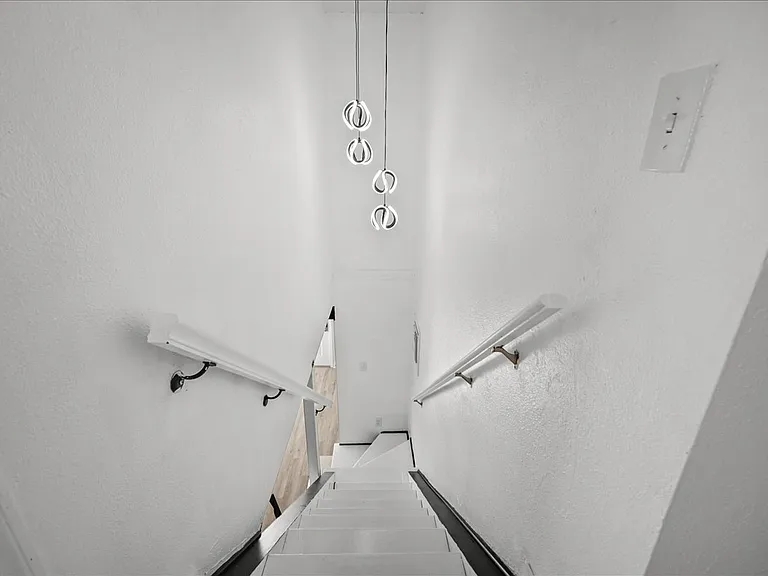 Stairwell with decorative light fixture