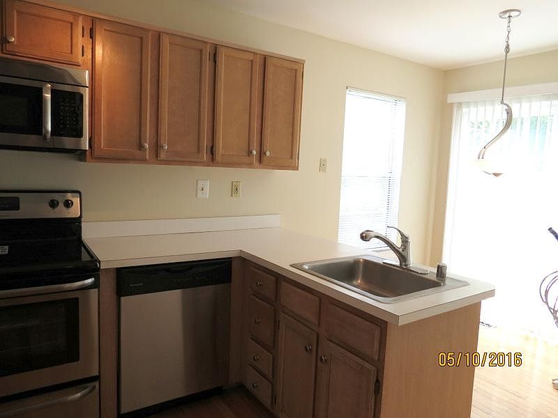 kitchen breakfast bar with eat in area with a view