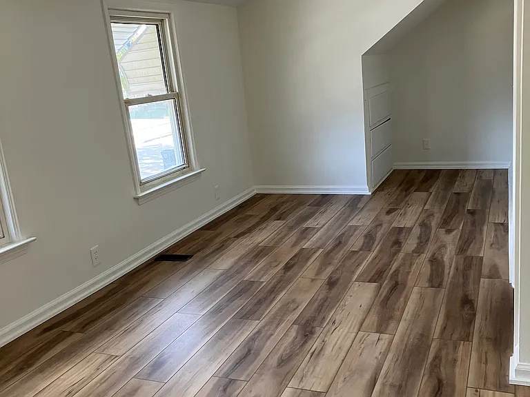 Large bedroom upstairs. Built in drawers in the arched cove. 1 Additional small bedroom upstairs