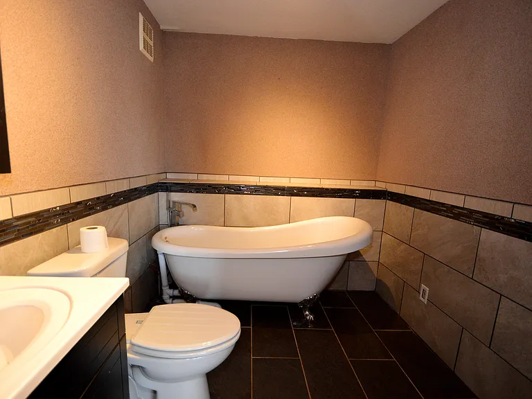 Tiled lower bathroom.