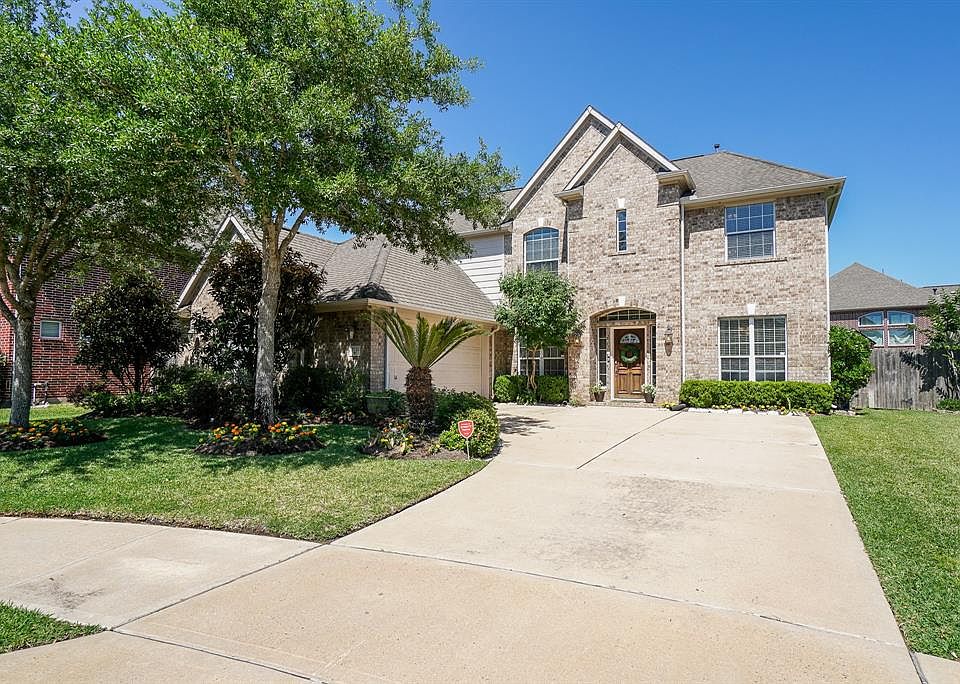 Curb appeal galore! Immaculate landscaping and mature trees give this charming home a welcoming feel from the moment you pull up.