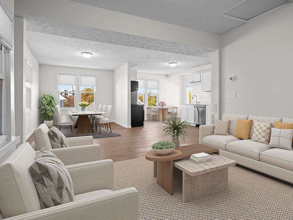 Large oversized, open concept living area, kitchen and dining area. The kitchen features a cozy breakfast nook. (Unit is leased unfurnished)