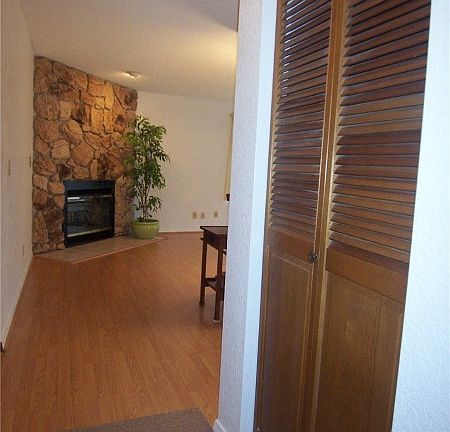 Entry with closet. Lovely hardwood floors throughout living room, dining room and kitchen.