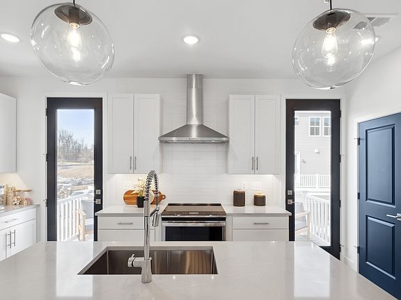 Kitchen with full-height tile backsplash