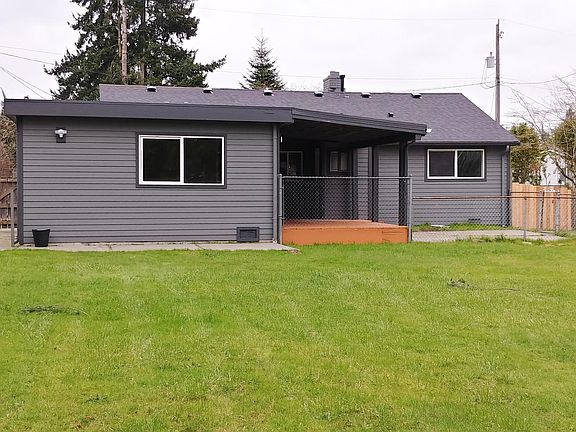 Back of house, showing the deck and patio. Great for enterta