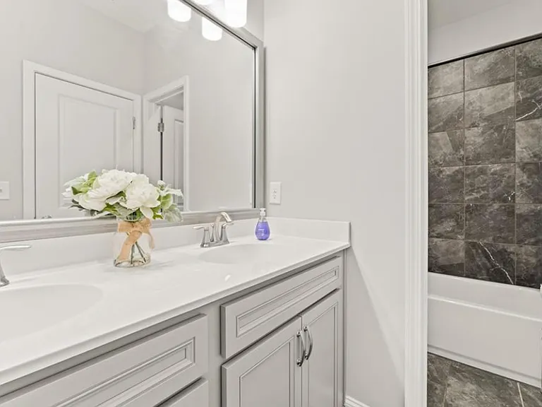 Full bathroom on second floor with double sinks