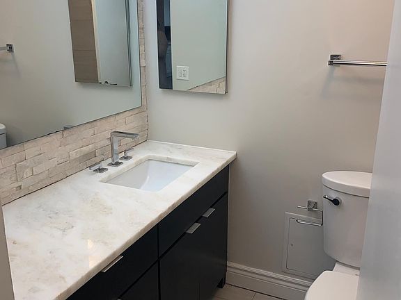 Large full length bathroom counter with lots of storage