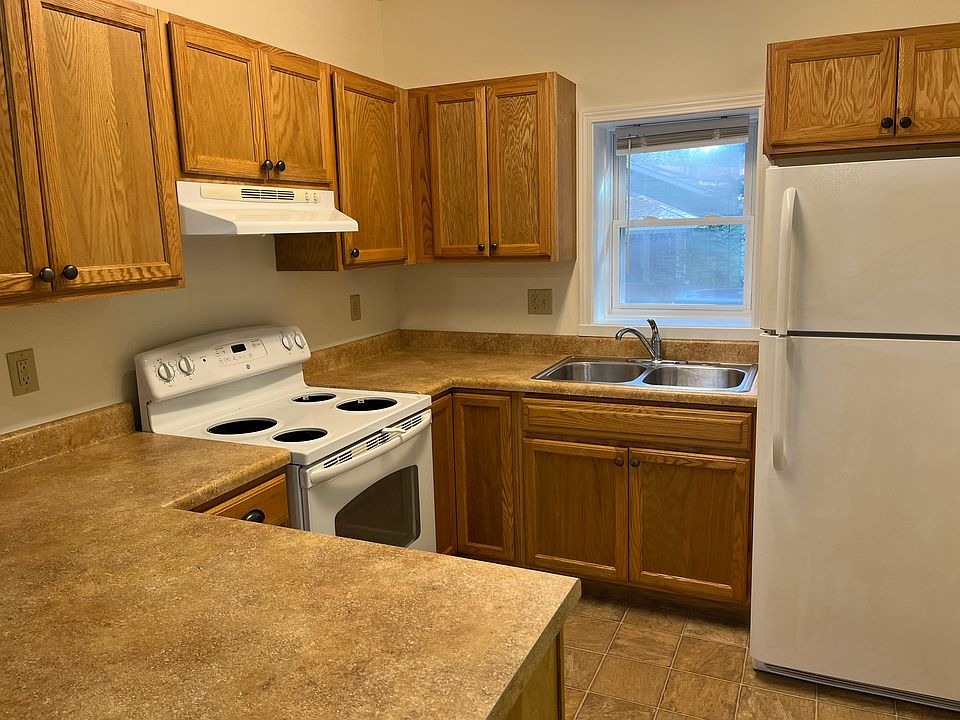 Kitchen has counter with ability to sit and eat there with stools