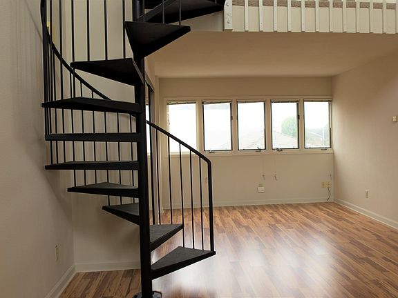 Living Room and stairs leading to loft bedroom.