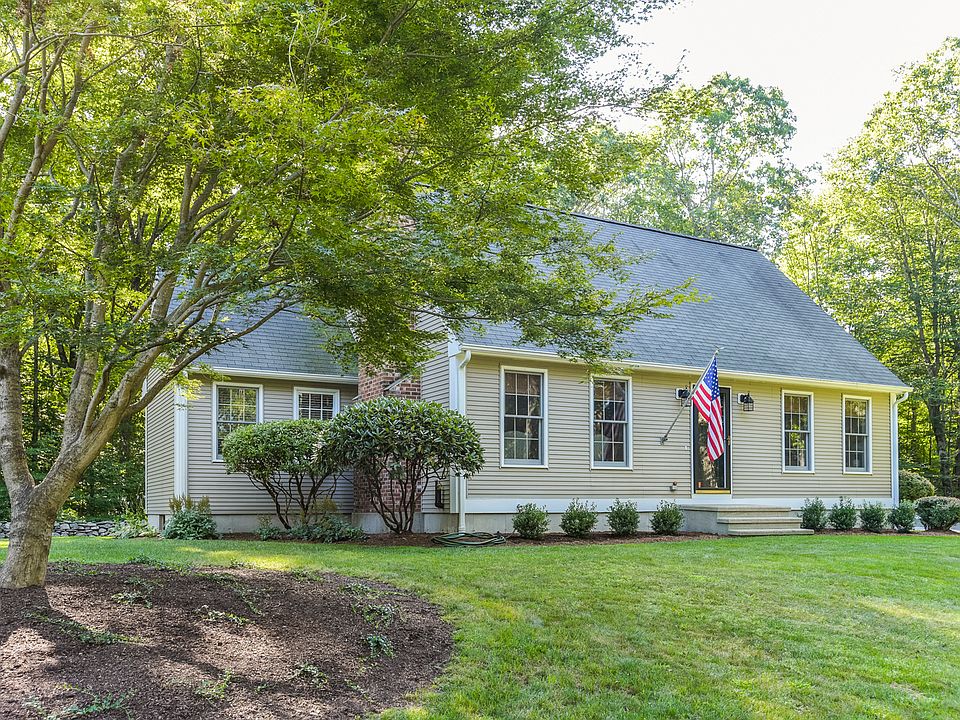 Front view of charming East Haddam home surrounded by landscaped grounds.