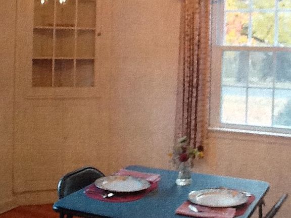 Dining room with built in corner hutch measures 12 & 1/2' x