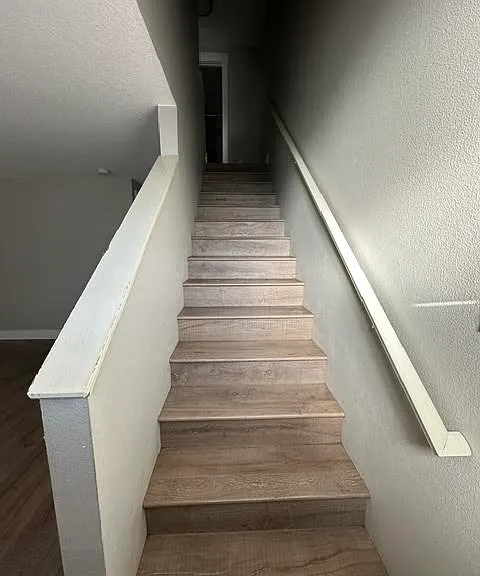 Stairs to upstairs bath and bedrooms