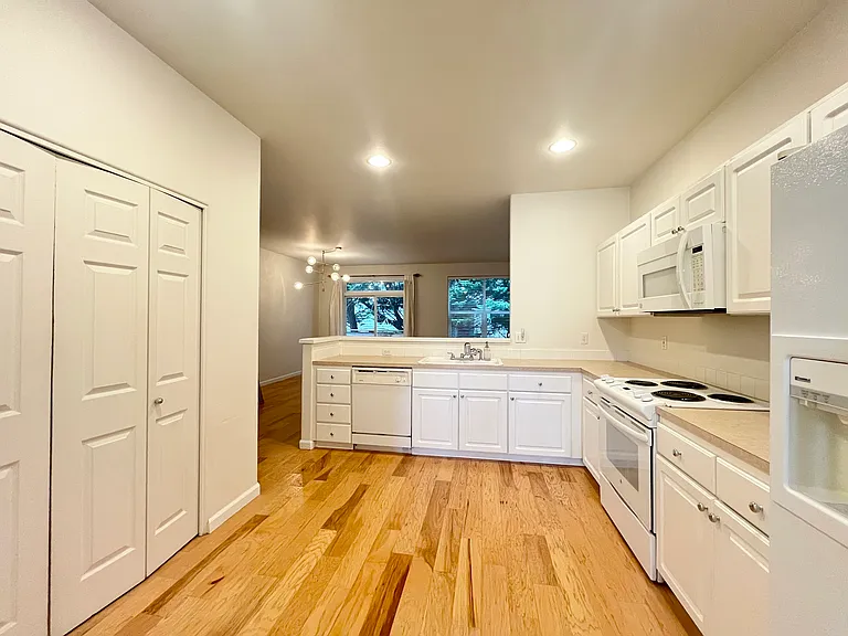 Another view of kitchen overlooking living/dining area