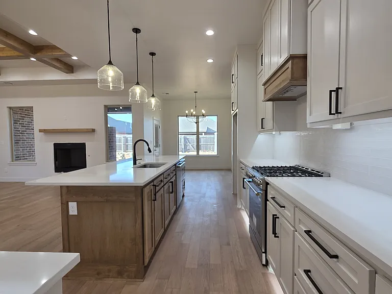 Kitchen features under cabinet and floor lighting and lots of storage