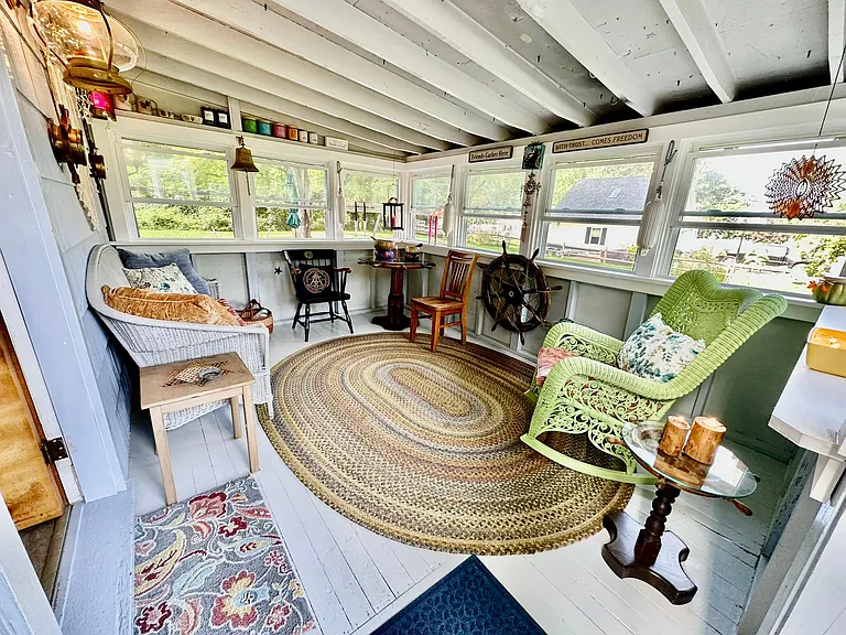 This three-season porch will provide endless hours of relaxation and rejuvenation.
