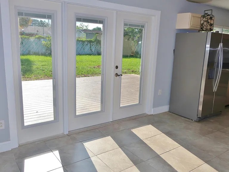 French doors to newly installed deck