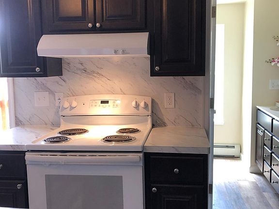 Counters on both sides of stove.