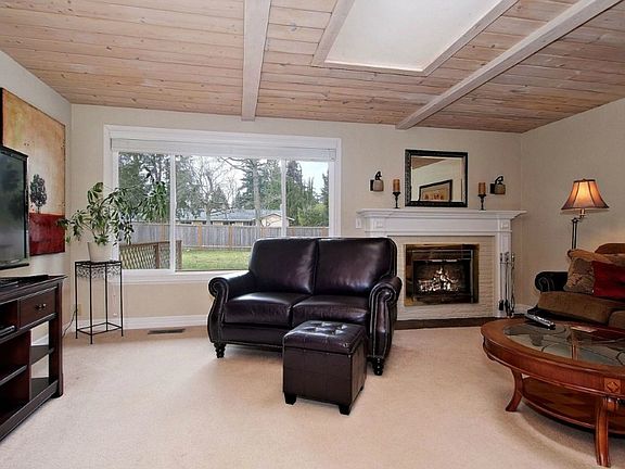 Living Room with wood fireplace and large picture window