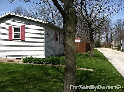 225 Bayview Drive
						:
						View from Bayview Drive on east side of property.