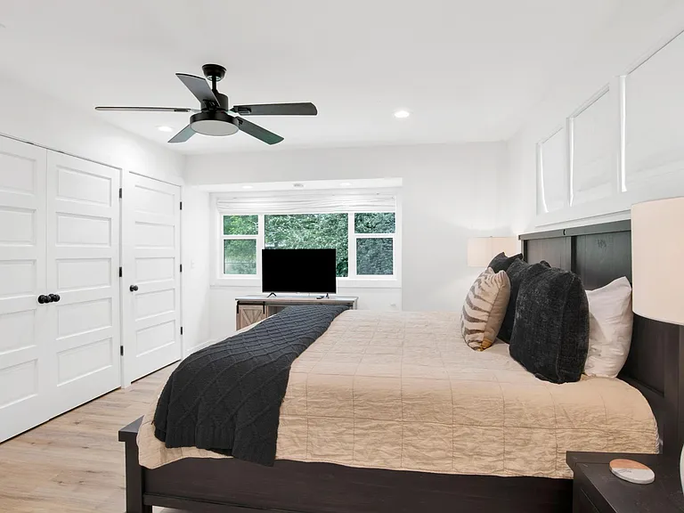 Washer / Dryer in closet along w optimum storage shelving.