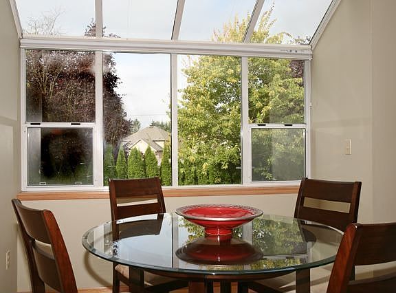Breakfast nook has own solarium window.