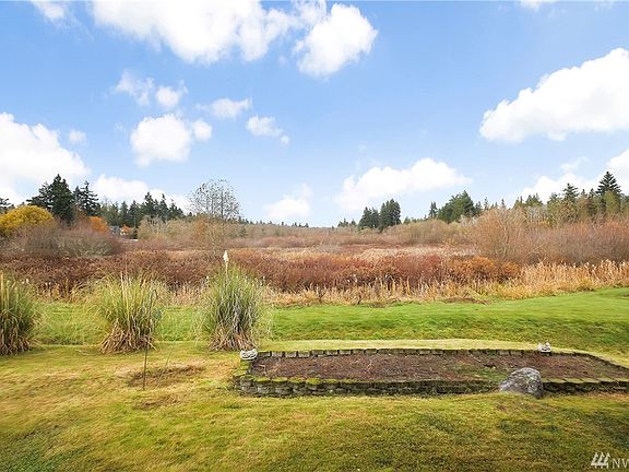 Land in front of home extending past garden space is designated as wetlands which prohibits construction to allow this view to be unobstructed. 