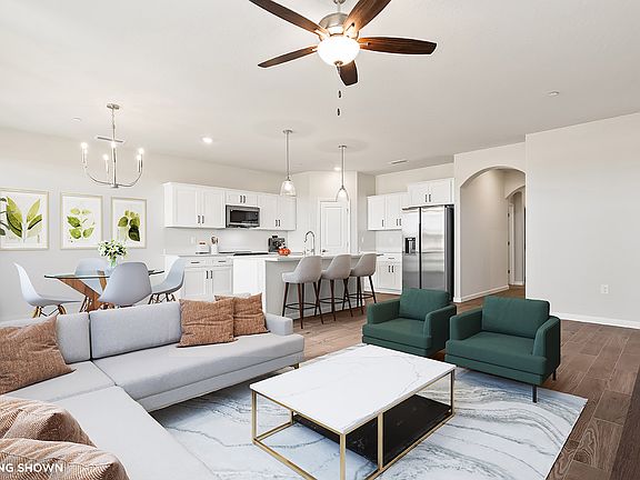 Great Room and Kitchen shown with virtual staging