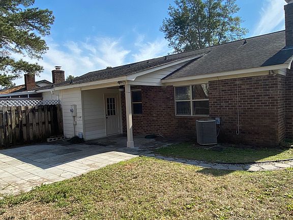 Back of property with covered porch