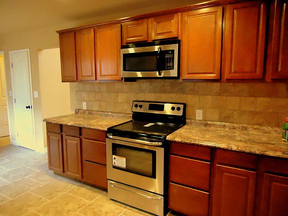 New cherry stained cabniets.