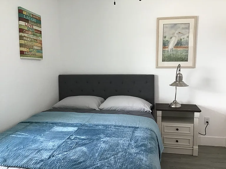 Each bedroom features a queen-size bed with underneath storage drawers and a Smart TV for added comfort and convenience.
