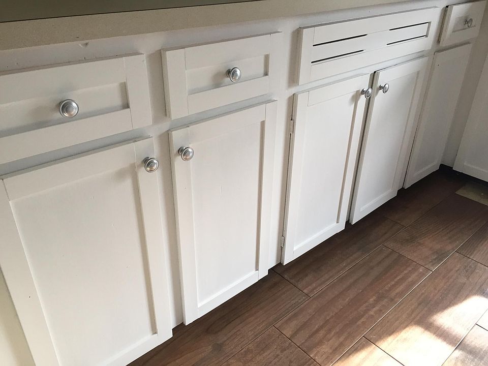 Refurbished Kitchen Cabinets and Ceramic Flooring