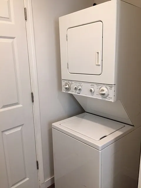 Washer and Dryer behind door at bathroom