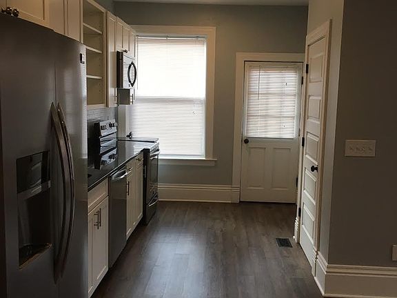 Kitchen view towards back entrance