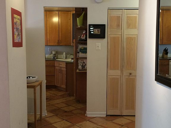View of entryway from just inside the front door. Living roo