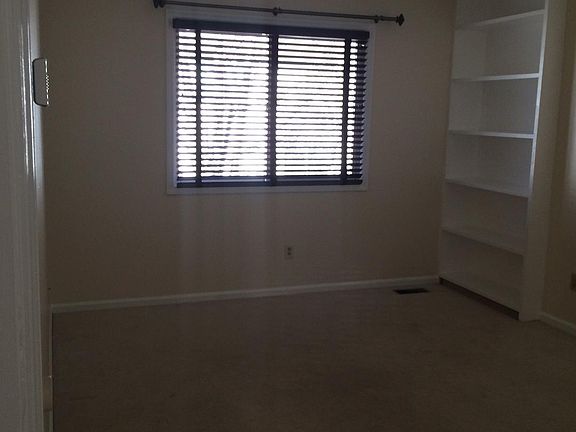 Large upstairs bedroom with built in shelving, 2 closets