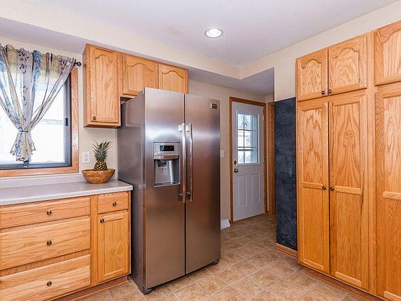 Kitchen with large pantry cabinets and soft-close drawers.