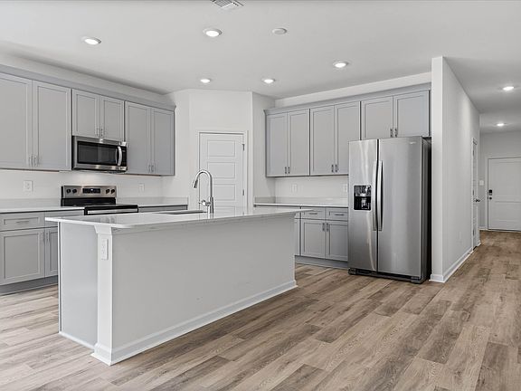 Kitchen in the Newport floorplan at a Meritage Homes community in Gulfport, MS.