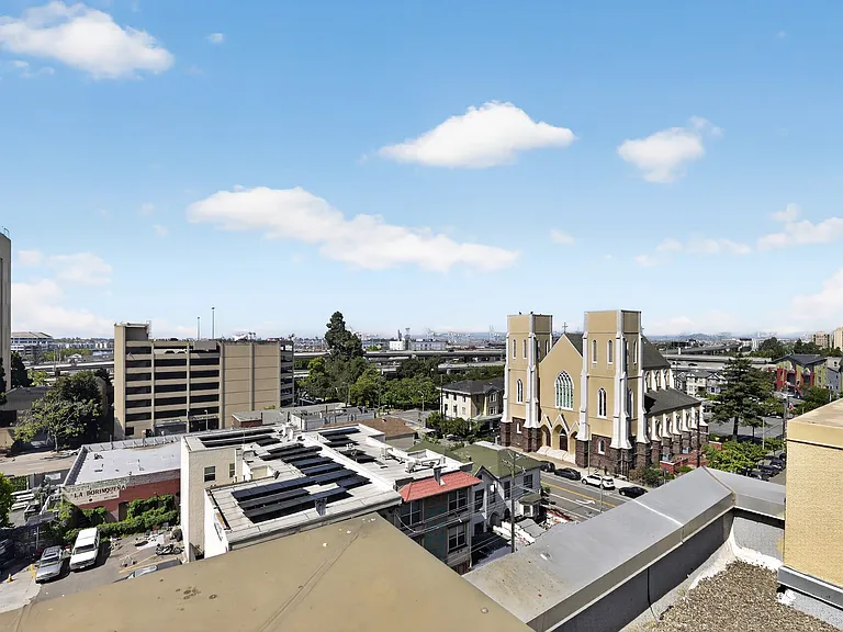 Rooftop view toward the waterfront, Jack London Square area, and surrounding Oakland landmarks.
