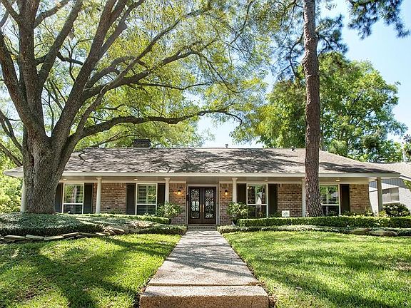 Lead glass dbl drs. Pretty curb appeal. High elevated corner lot and graceful wide front porch with 