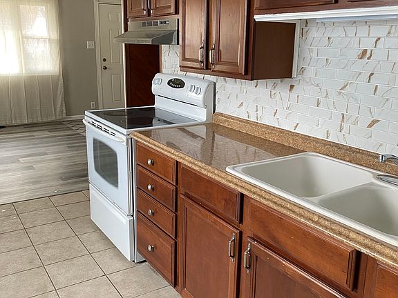 Kitchen with tiled back splash