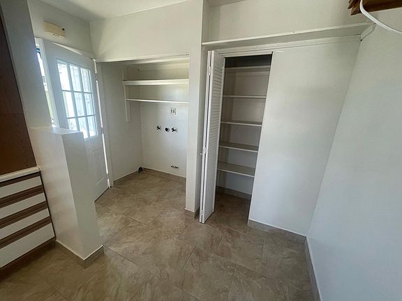 Laundry hookups off kitchen and Pantry