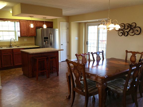 SLIDING DOORS PROVIDE KITCHEN ACCESS TO BACK DECK
