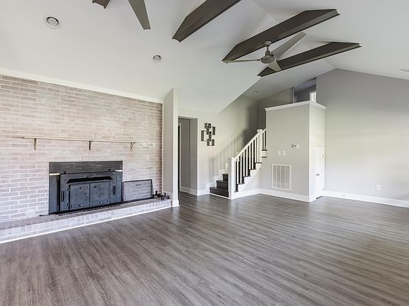 Stairs leading up to the two additional bedrooms and one full bathroom.