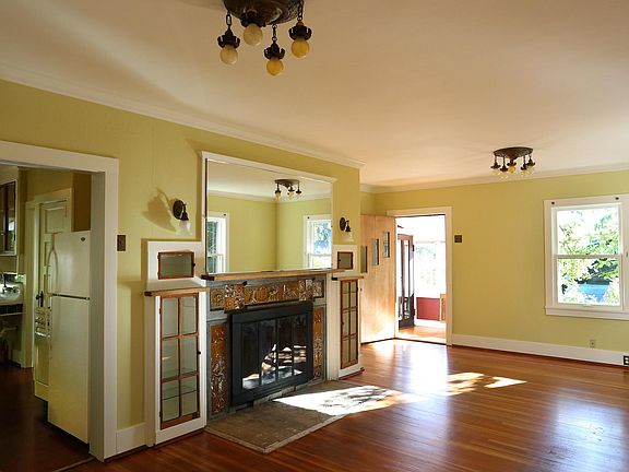 Living room/dining room combination leads to sunroom/office
